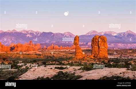 Moonrise Over The La Sal Mountains And Balanced Rock In Arches National