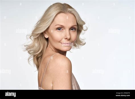 Portrait Of Happy 50s Sophisticated Woman Looking At Camera Isolated On