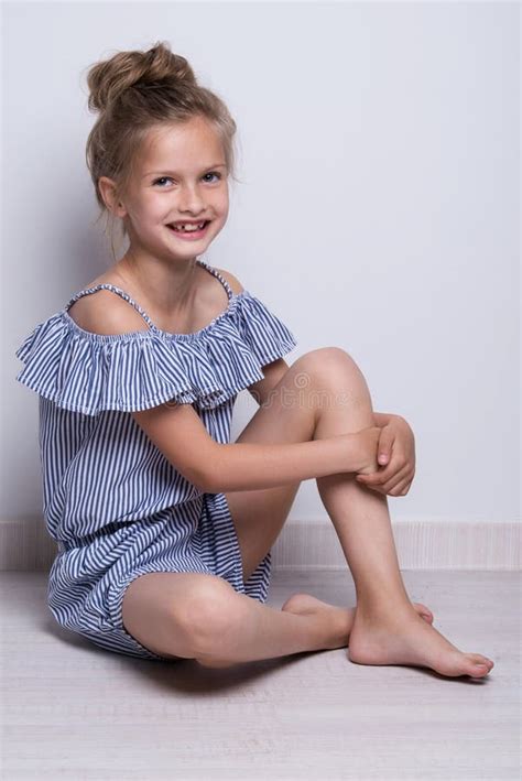 Beautiful Little Fashion Model On White Background Portrait Of Cute