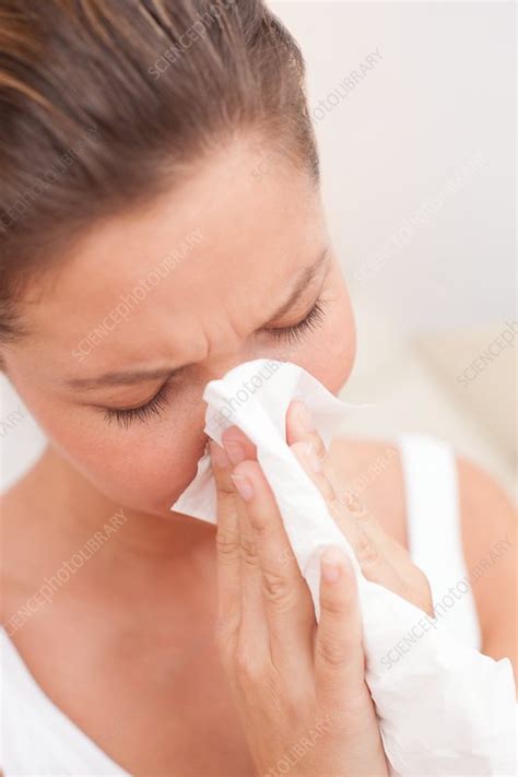 Woman Blowing Nose On Tissue Stock Image F Science Photo