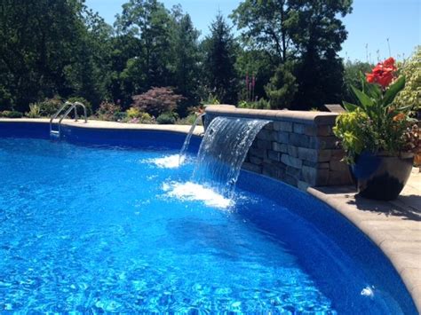 Swimming pool waterfall kits are the most foolproof waterfalls on the market. True Blue Pools added ambiance to this pool with a ...