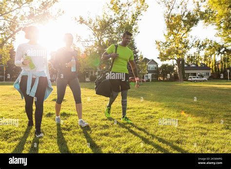 Three People Walking In Park After Running Club Stock Photo Alamy