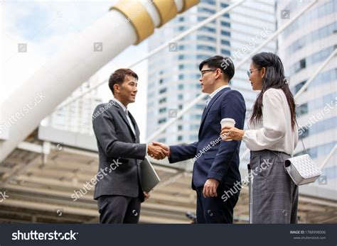 Business People Standing Front Building Handshake Stock Photo