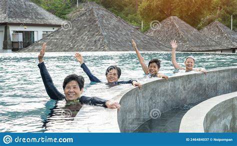 healthy asian elderly aging senior old friends exercising in swimming pool having fun enjoying