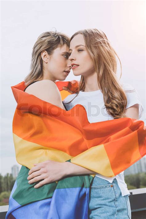 Sensual Babe Lesbian Couple Posing With Lgbt Flag Outdoors Stock Image Colourbox