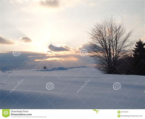 Idylic Sunset At A Winter Snowy Field In The Twilight Stock Image