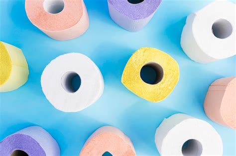 Flat Lay Colorful Toilet Paper Rolls On Desk Free Photo