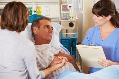 Nurse Talking To Couple On Ward Stock Photo By ©monkeybusiness 24654393