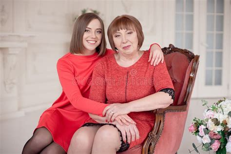 Mature Mother And Daughter Hugging Stock Image Image Of House
