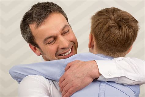 Father Hugging His Son 2022475 Stock Photo At Vecteezy