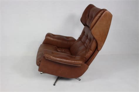 Leather sofa and armchair retro style vintage style seating tan leather. Vintage leather swivel armchair - 1960s - Design Market