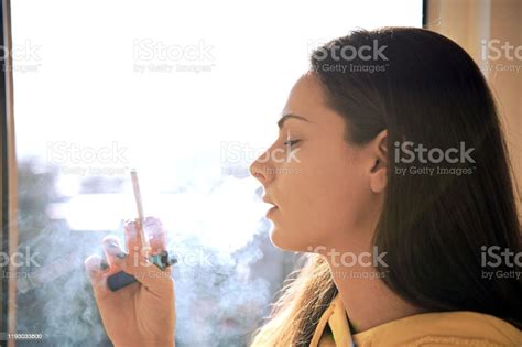 Beautiful Attractive Girl Smoking A Cigarette At The Window Pretty