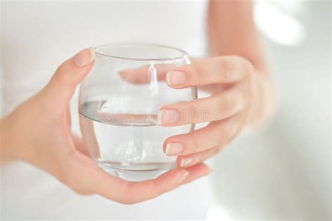 Female Hands Holding A Clear Glass Of Water Stock Photo Image Of