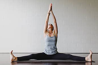 A Beautiful Woman Practicing Yoga In A Studio Stocksy United