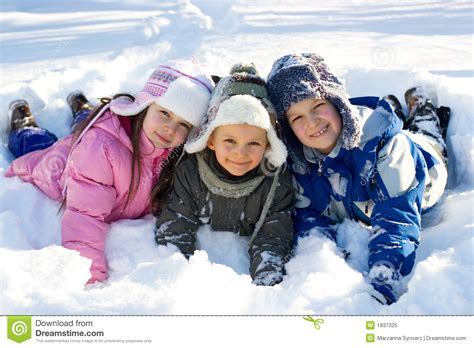 Three Kids Playing In Fresh Snow Stock Image Image Of