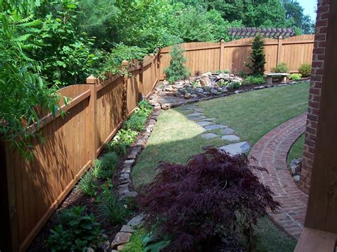 Can you imagine the lower front flower bed in front of the rock wall now being planted with attractive annual flowers? Flower bed rock borders, floating flagstone walkways - Yelp
