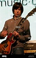 Mark Collins of the English rock band, The Charlatans playing guitar ...