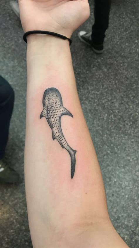 A Small Whale Tattoo On The Arm