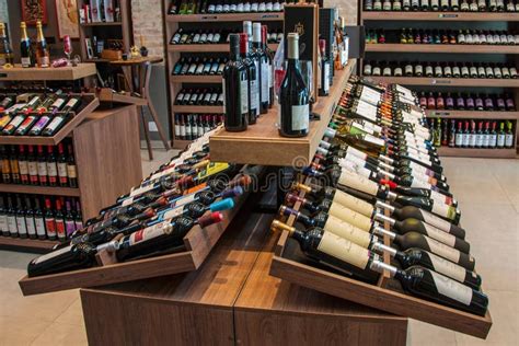 Wine Bottles For Sale On Shelves In A Wine Shop Editorial Stock Photo