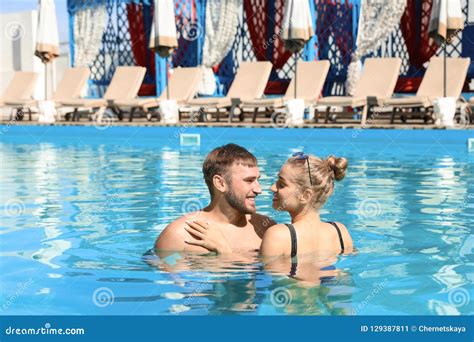 Happy Young Couple In Swimming Pool Stock Image Image Of Romantic