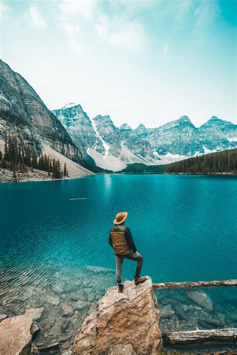 Free Download Man Standing On Rock Near Lake Photo Free Canada Image On