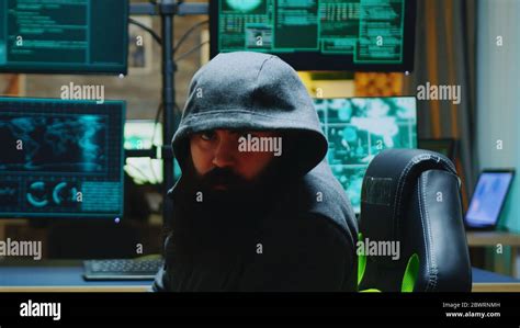 Dangerous Hacker Wearing A Hoodies And Looking Into The Camera Cyber