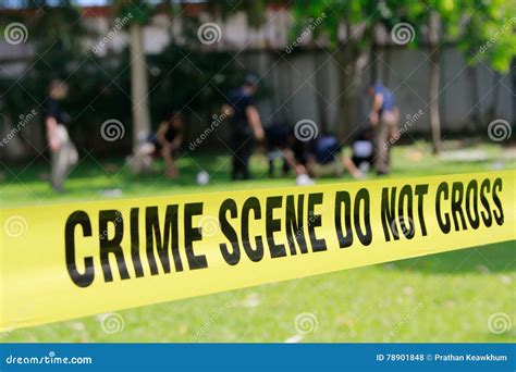 Crime Scene Tape and Blurred Law Enforcement Team Stock Photo - Image