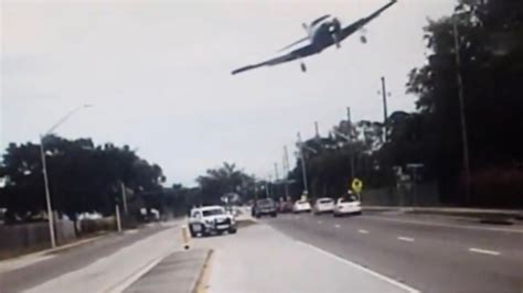 Police Dash Cam Captures Florida Man Crash Landing Small Plane On Busy Road