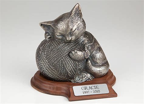 We deliver our range of cremation urns, keepsake urns and ashes jewellery australia wide. Precious Kitty Silver Cremation Urn - Cat with yarn, engraved
