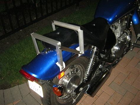A motorcycle luggage rack will increase the functionality of your motorcycle and will offer the capability to carry saddlebags or other devices to secure all your belongings. DIY motorcycle rack - Grumble Grumble