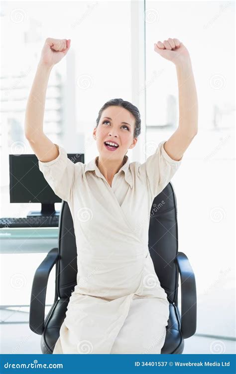 Excited Stylish Brunette Businesswoman Raising Her Arms Stock Image