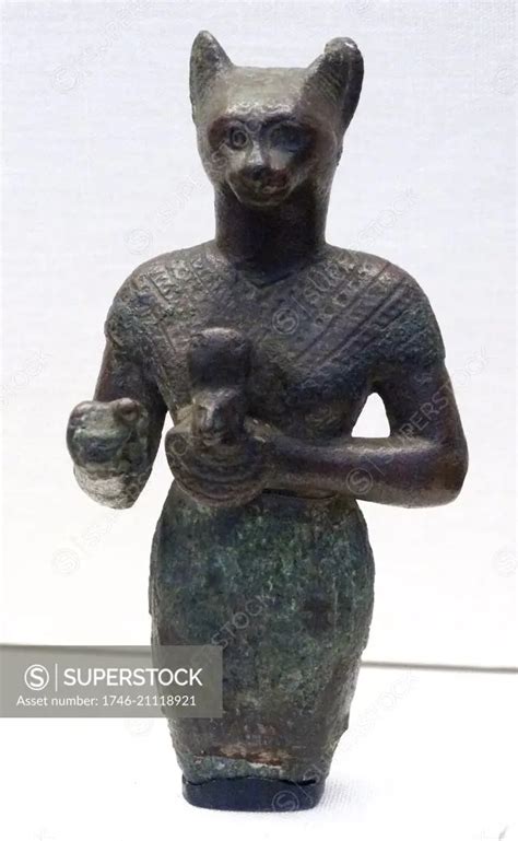 Upper Portion Of A Bronze Figure Of Bastet Holding A Cat Aegis From