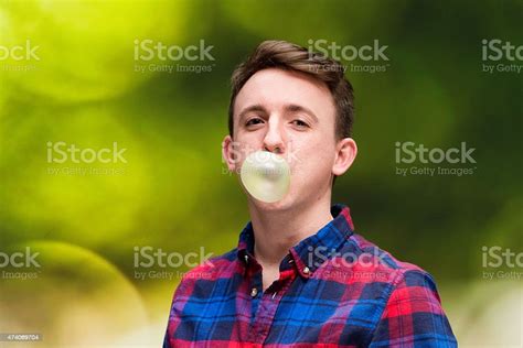 Man Blowing Bubble With Gum Stock Photo Download Image Now 20 24