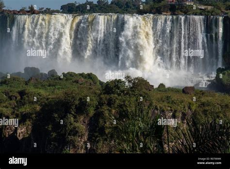 Iguazu Falls On The Border Of Argentina And Brazil On A Sunny Morning