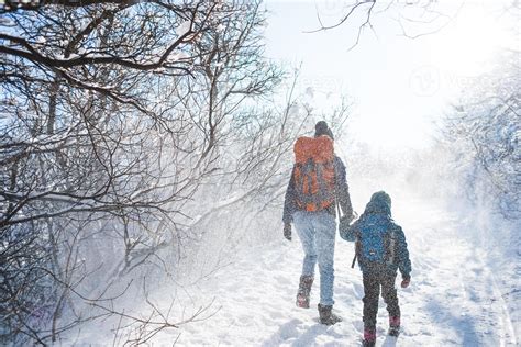 Woman With A Child On A Winter Hike In The Mountains 4952615 Stock