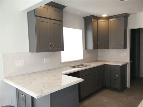With over 20 years experience in kitchen and cabinet design and manufacture, we have helped hundreds of people in auckland, get the kitchen they want. dark gray shaker cabinets with silestone quartz countertop ...