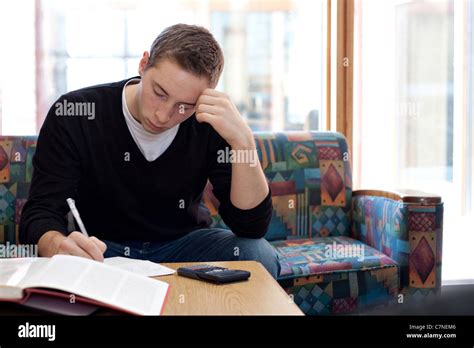 A Young College Student Cramming Before His Final Exams Stock Photo Alamy