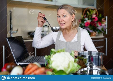 Mature Woman In Kitchen Preparing Food Stock Image Image Of Chef
