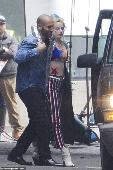 Margot Robbie Is Carried Across Set As She Gets Into Character As Harley Quinn Daily Mail Online