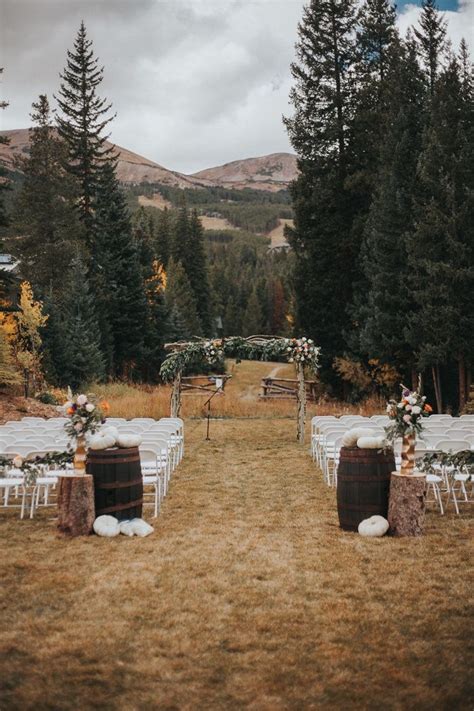 Fall Outdoor Mountain Wedding Ceremony With White Pumpkins And Lush