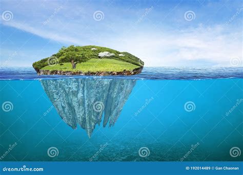 Beautiful Underwater View Of Lone Small Island Above And Below The