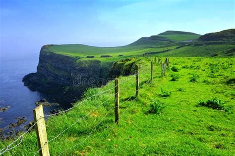 Scenic Cliffs Of The Causeway Coast Northern Ireland With Light Early