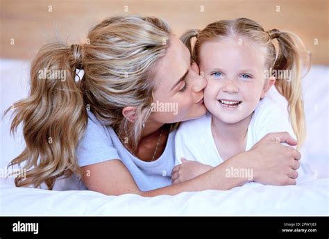 Two Blonde Caucasian Females Only Looking Relaxed And Positive While Lying In Bed Together