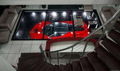 An Overhead View Of A Car Parked In A Garage With Stairs Leading Up To It