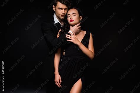 Passionate Man Choking Sexy And Submissive Woman In Dress Isolated On Black Stock Photo Adobe