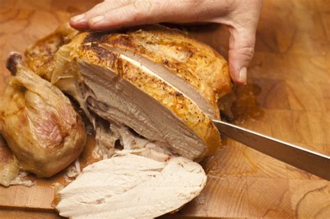 Would you like to serve healthy meals to your family every day of the week, but you can't seem to find enough time for cooking? cutting roasted chicken with knife - Free Stock Image