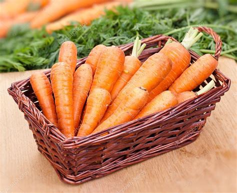 Fresh Carrots In A Basket On The Table Stock Photo By ©timmary 27318739