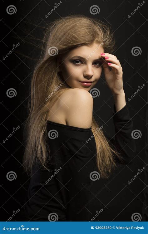 Tender Young Blonde Model With Long Lush Hair At Studio Stock Photo