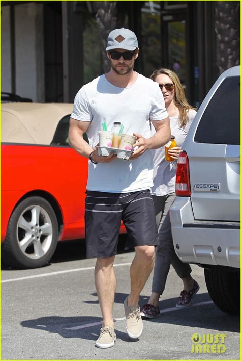 Full Sized Photo Of Chris Hemsworth Muscles Can Barely Fit In His Shirt