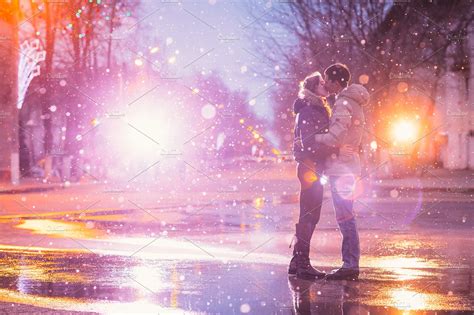 In Love Couple Kissing In The Snow Featuring Snow Rain And Urban